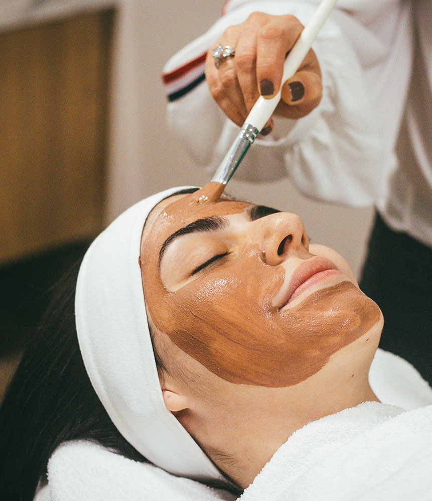 Woman getting a facial at a spa